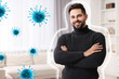© New Africa - Man with strong immunity surrounded by viruses at home
