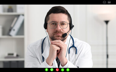 Canvas Print - Online medical consultation. Doctor with headset working via video chat application