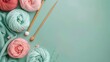 © Ziyan Yang - A set of knitting yarn and tools in spring colors. Handmade concept, creative art, crafting process. Hobby, relax, lifestyle, flat lay on pastel green background, top view