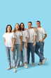 © Pixel-Shot - Group of young people in stylish jeans on blue background