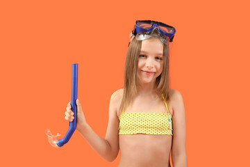 Poster - Cute little girl in swimsuit with snorkeling mask on orange background