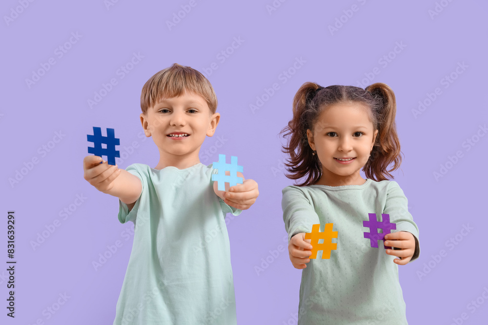 Cute little kids with hashtags on lilac background