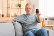 © Pixel-Shot - Senior man with glucometer sitting on sofa at home. Diabetes concept