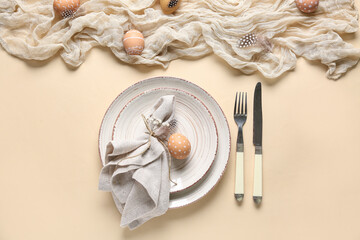 Wall Mural - Beautiful table setting with Easter eggs and gypsophila flowers on beige background