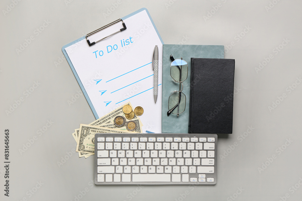 Composition with to do list, keyboard and eyeglasses on grey background. Time management concept. Top view