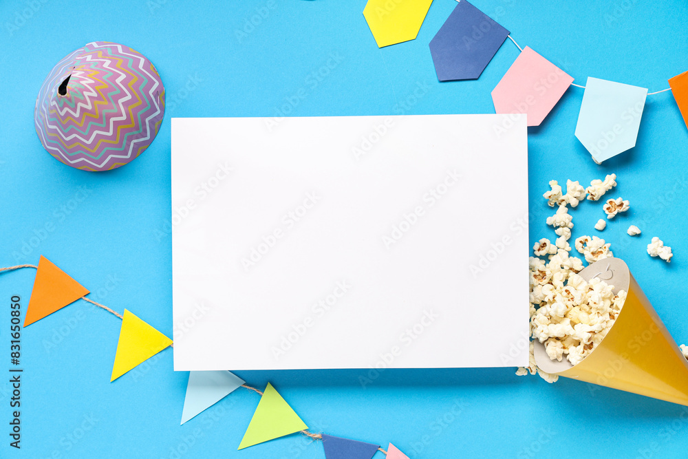 Composition with blank card, popcorn and decor for Festa Junina celebration on color background