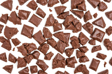 Sticker - Chocolate pieces scattered on white background