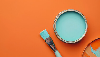 creative diy project setup with orange background and blue paint with copy space for text