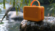 © Jammy Jean - Portable music speaker showcasing on a rock. Bluetooth wireless gadget.