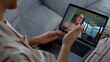 © stockbusters - Closeup daughter videocall dad online At home. Cute girl waving in laptop screen