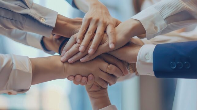 Office worker team stacking hand together symbolize successful group of business partnership and strong collective unity teamwork in community workplace in panoramic banner
