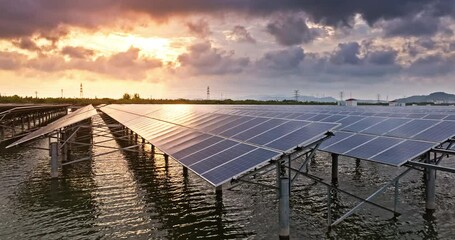 Wall Mural - Solar panels in lake and cloudscape at sunset