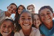 © Iigo - Portrait of a group of smiling kids standing together on a sunny day