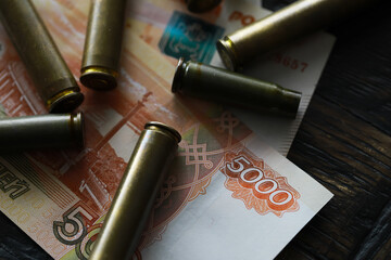 Wall Mural - Bullets lie on the russians money money with inscription five thousands rubles top view