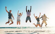 © Lyndon Stratford/peopleimages.com - Beach, diversity and group of friends jumping in sky for summer holiday with happiness, youth and excited. Ocean, multicultural and people in air for school reunion with memory, smile and energy
