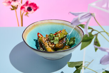 Spicy smashed cucumber salad in Asian style; a fresh and creative culinary presentation with a surreal summer vibe