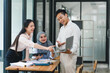 © PRIME STOCK LAB - Diverse team collaborating in modern office during daytime meeting