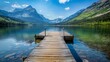 © Pik_Lover - A wooden dock sits in a lake surrounded by mountains.