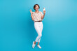 © deagreez - Full size portrait of excited nice girl hold smart phone make selfie arm palm waving hi isolated on blue color background