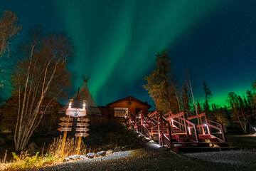 Wall Mural - Yellowknife, Northwest Territories, Canada - September 24 2022 : Northern lights at Aurora Village in Yellowknife night.