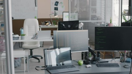 Wall Mural - no people shot of contemporary it office interior with codes on computer and laptop screens on desk 