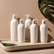 © IKvyatkovskaya - Set of white plastic pomp bottles for shampoo, hair treatment or soap on beige tray with green monstera leaves and sun light. Unbranded mockup. AI Generative