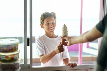 Shop, window or excited boy child with ice cream surprise outdoor for snack, request or payment on vacation. Industry, customer service or business server hand with kid at a beach for summer dessert