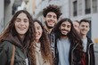 © Iigo - Group of friends walking in the city. Group of young people having fun outdoors.