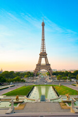 Poster - Paris Eiffel Tower and Trocadero garden at sunset in Paris, France. Eiffel Tower is one of the most famous landmarks of Paris.