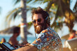 © PLATİNUM - A man with headphones and a beard plays a keyboard