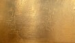 © Juri_Tichonow - An antique textured gold background with uneven surface showing age and wear.