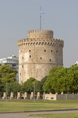 Wall Mural - Greek Flag at Top of White Tower of Thessaloniki Historic Landmark