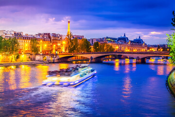 Wall Mural - pont neuf and cite island over seine river with floating boat at night, france, retro toned