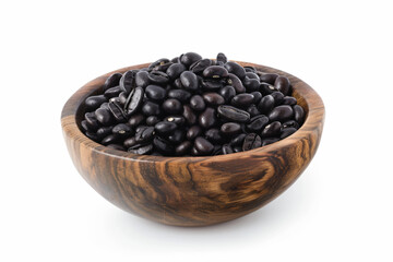 Wall Mural - a wooden bowl filled with black beans on a white surface