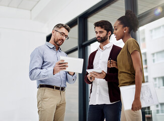 Poster - Employee, people and serious at office with tablet for teamwork or collaboration and project. Ideas, discussion and accountant with sharing information or knowledge and feedback on company finance