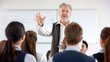 © Дмитрий Симаков - A man is giving a presentation to a large audience. The man is dressed in a suit and tie and is standing in front of a white board. The audience is attentive and listening to the man's presentation