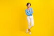 © deagreez - Full length photo of cool optimistic woman dressed print blouse white trousers standing arms crossed isolated on yellow color background