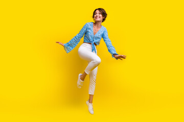 Canvas Print - Full length photo of lovely optimistic girl wear blue summer top flying look at discount empty space isolated on yellow color background