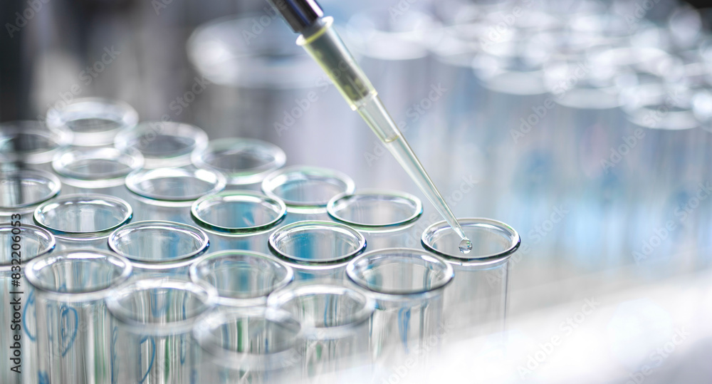 [various]Pharmaceutical Research, scientist pipetting sample into a ...