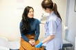 © Connect Images - Nurse checking patient's vitals in clinic