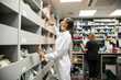 © Connect Images - Pharmacists working in a medication storage room in a medical practice, UK
