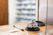 © Connect Images - Reception desk with service bell and pen in a medical practice