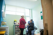 © Connect Images - Nurse performing blood test to patient in clinic.