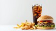 © The 2R Artificiality - Tasty hamburger soft drink and fries against a white backdrop