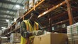 © OZ - Black Man Working and Labeling in a Warehouse