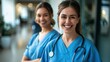 ©  Abby Photo - Smiling beautiful female healthcare workers looking at the camera