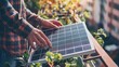 © BMMP Studio - Close-up of hands installing a small solar panel on a home balcony, empowering sustainable living.
