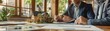 © ParinApril - Professional setting of a real estate consultation with focused agent, model house on the table showcasing home buying or selling