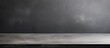 © Gular - metal gray table surface for background copy space on gray wall background