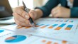 © Ganesha88 - analysis working with the latest financial results. Analysis of sales forecast graphs, financial accounting with hand writing Abstract digital effect for background
